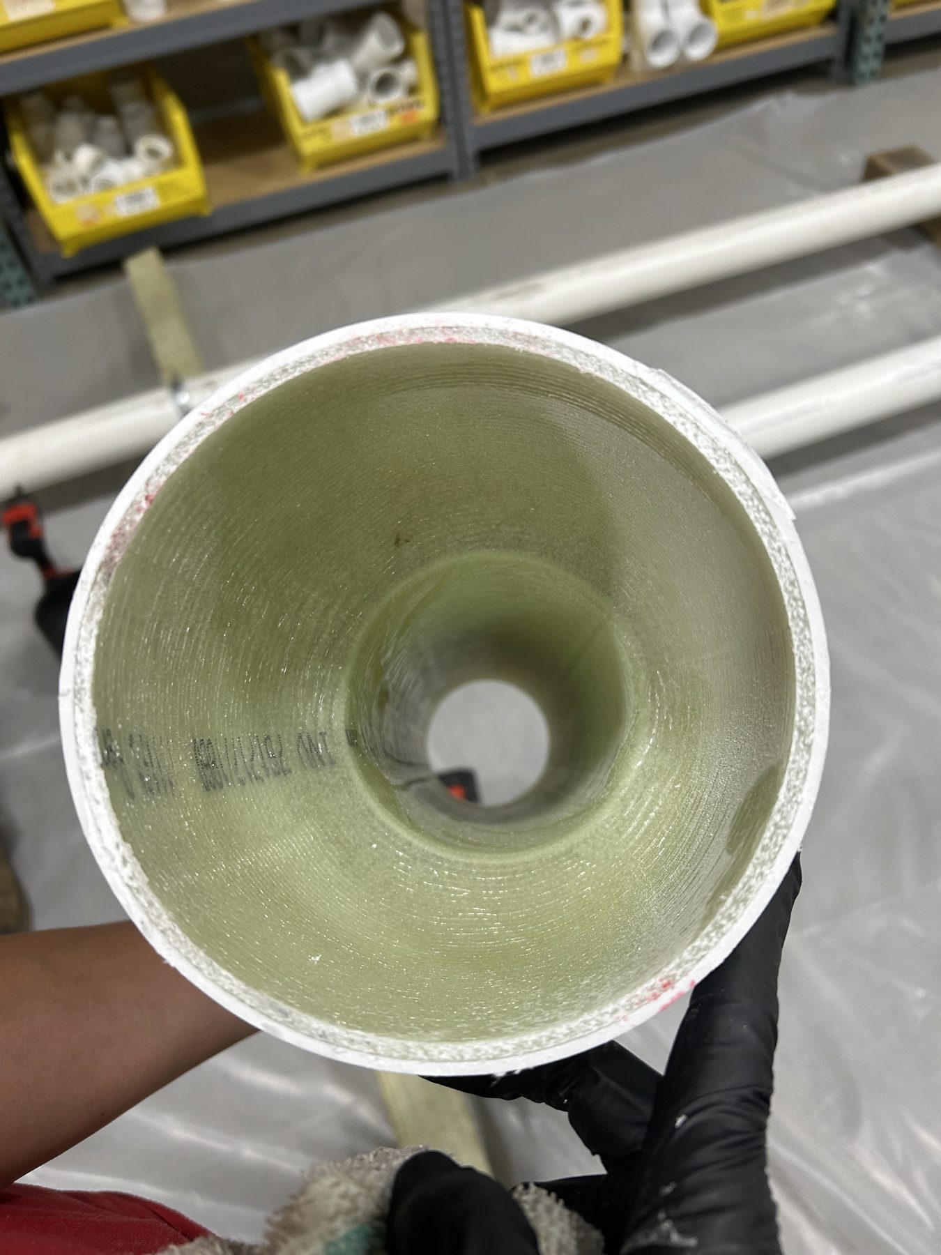 Cross section of a cured pipe liner forming a new pipe inside an old one