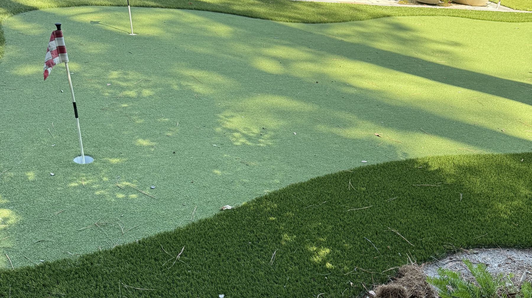 Lined beneath a putting green